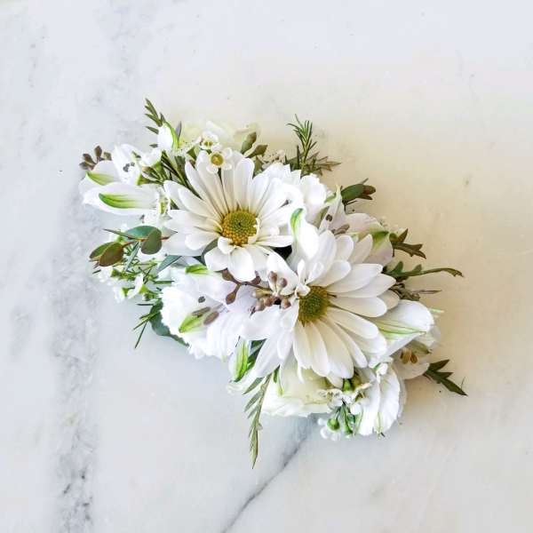 White daisy bouquet with small white accent flowers and greenery