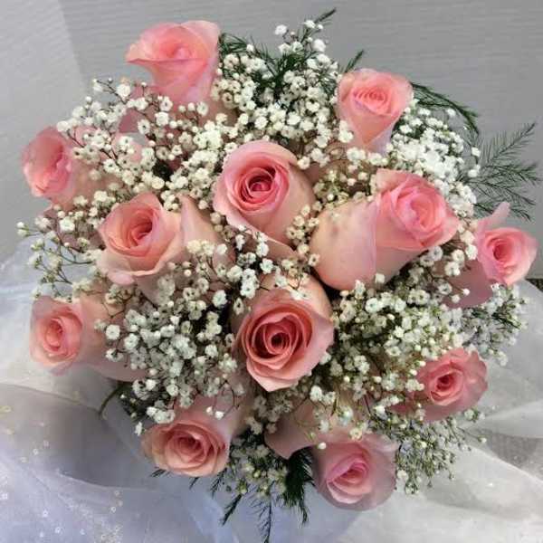 Bouquet of pink roses and white baby's breath