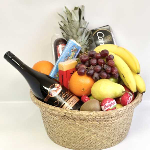 Gift basket with wine, fruit, cheese, and chocolates