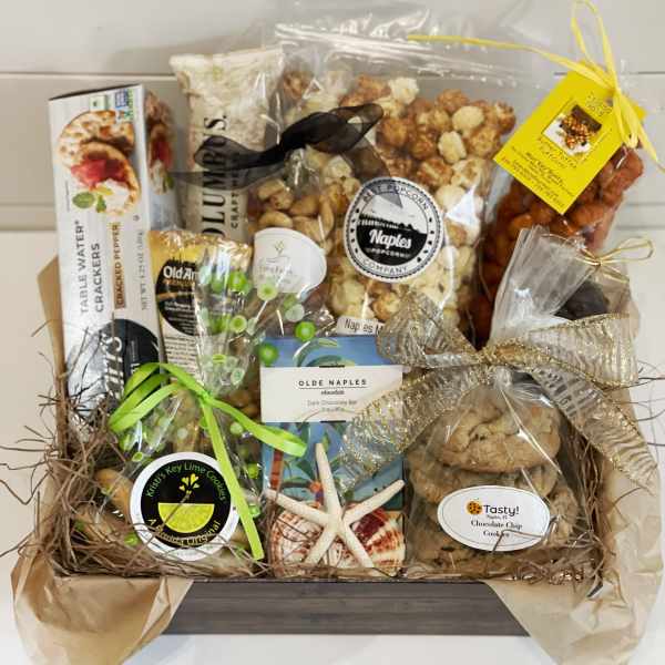 Gift basket with assorted packaged snacks and cookies tied with ribbons