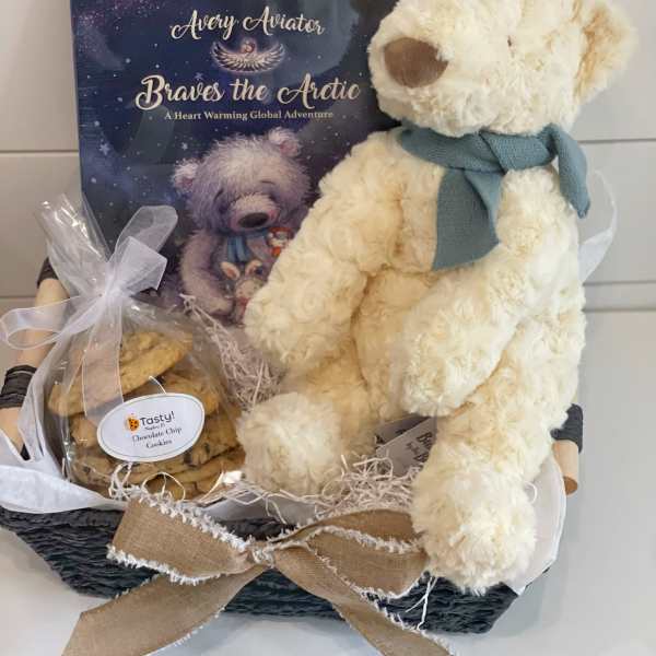 Gift basket with a teddy bear, cookies, and a children's book