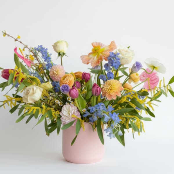 Colorful mixed bouquet in a pink vase