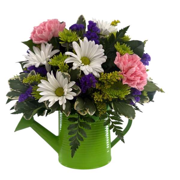 Pink carnations and white daisies in a green watering can