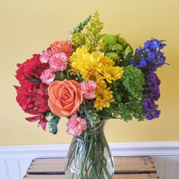 Colorful mixed bouquet in a clear glass vase