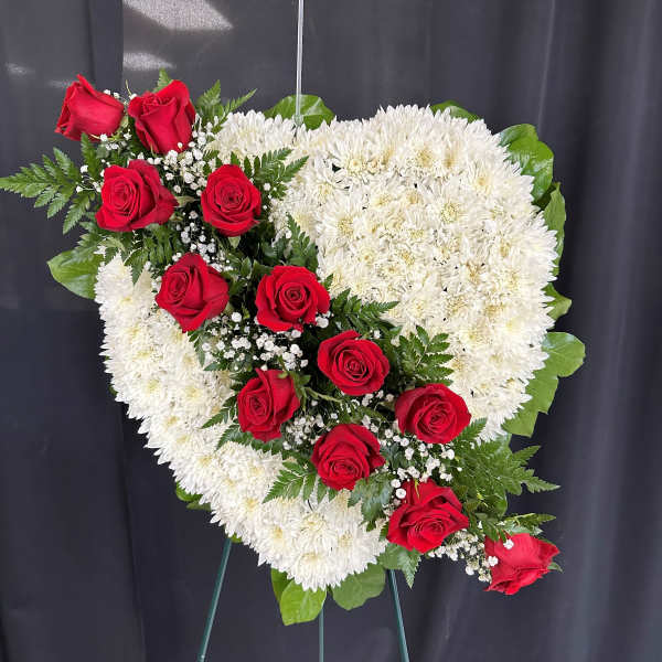 Heart-shaped standing spray of red roses and white chrysanthemums