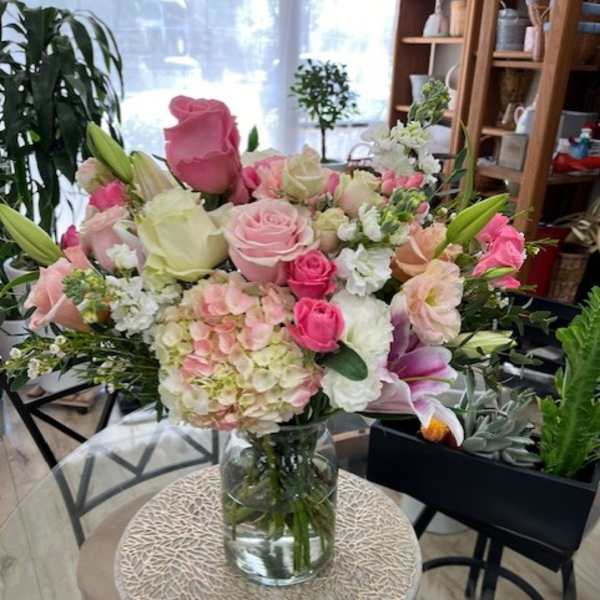 Pink and white mixed bouquet in a clear glass vase