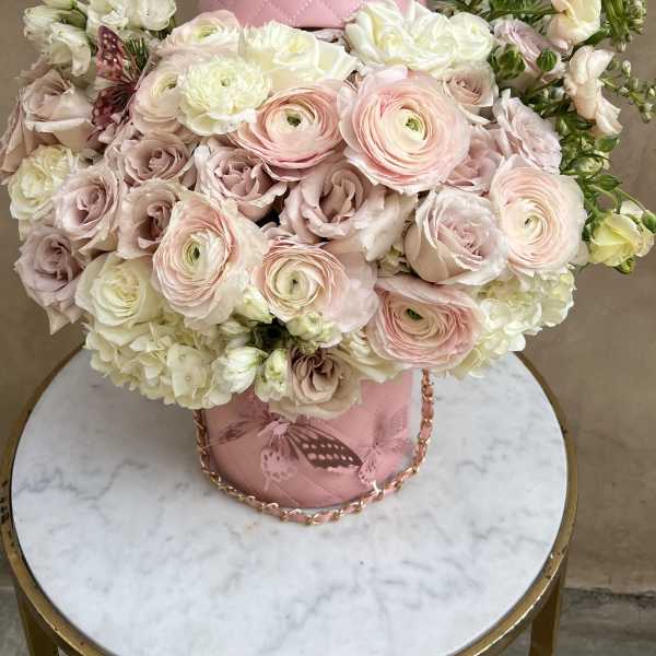Pink and white bouquet in a quilted pink hatbox
