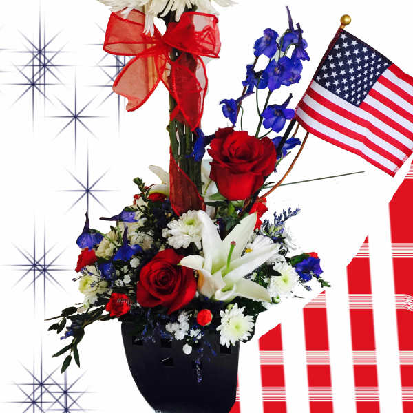 Red, white, and blue floral arrangement with an American flag