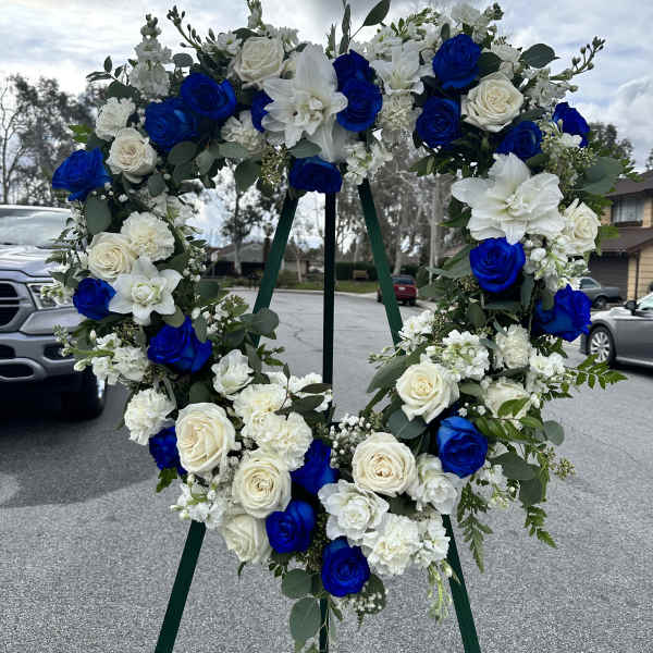 Blue and white floral wreath on a stand