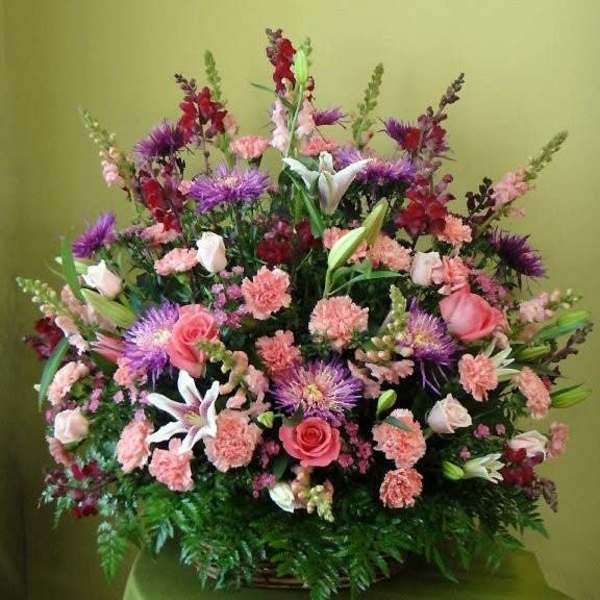Large mixed bouquet with pink roses, lilies, and purple flowers
