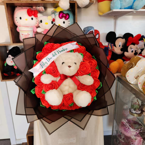 Teddy bear bouquet with red roses and a ribbon