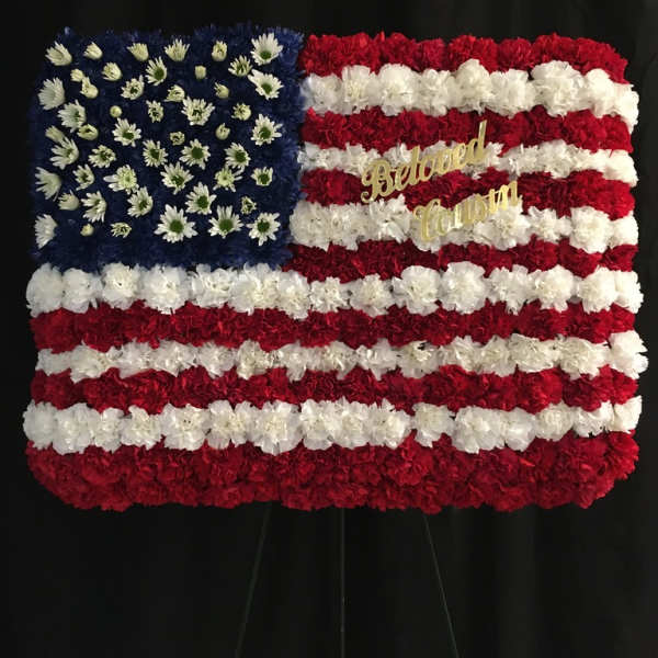 Floral American flag display with red, white, and blue flowers
