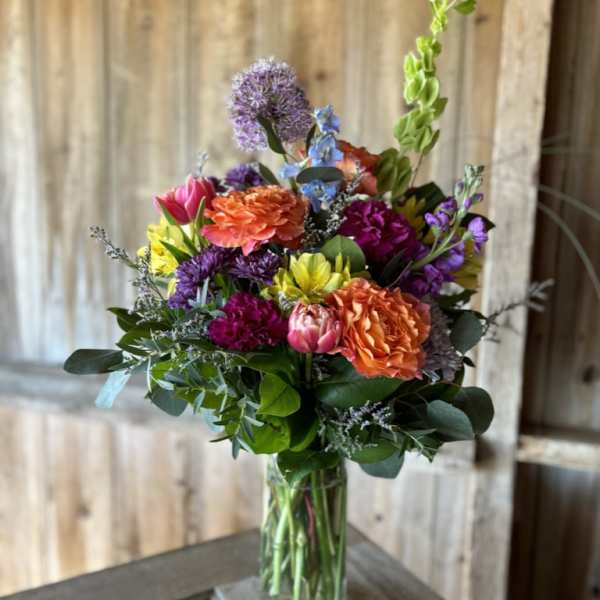 Colorful mixed bouquet in a clear glass vase