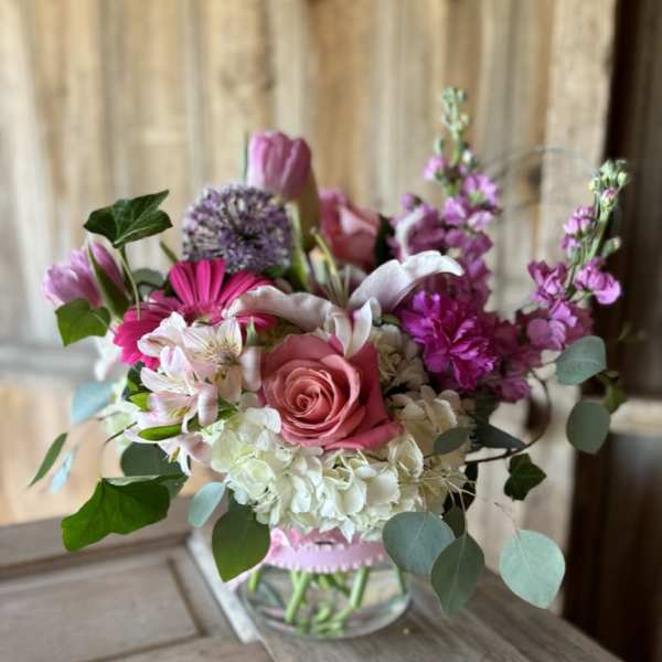 Pink and white mixed bouquet in a clear glass vase