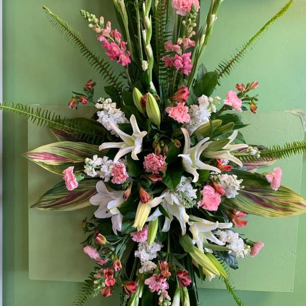 Tall floral spray with white lilies and pink carnations