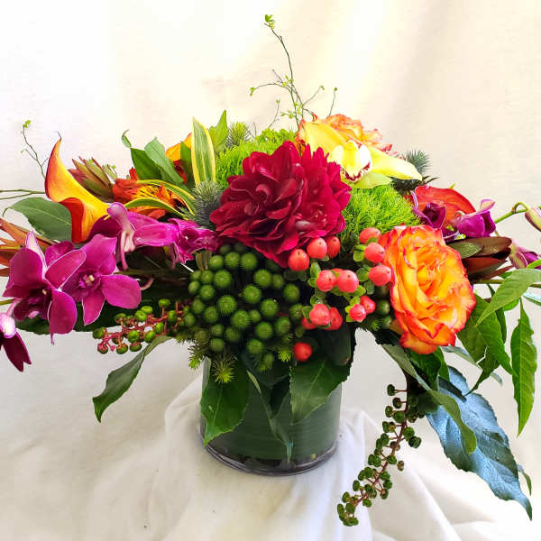 Colorful mixed floral arrangement in a glass vase