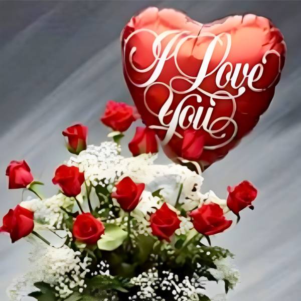 Red roses with a heart-shaped "Love You" balloon, teddy bear, and chocolate box
