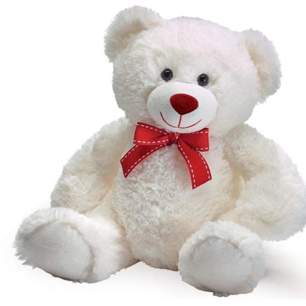 White teddy bear with a red bow on a plain background