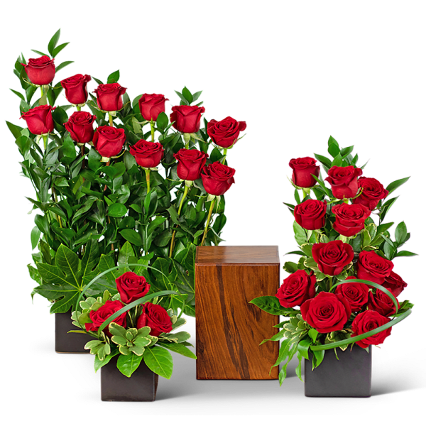 Red roses arranged in black square vases with a wooden cube centerpiece