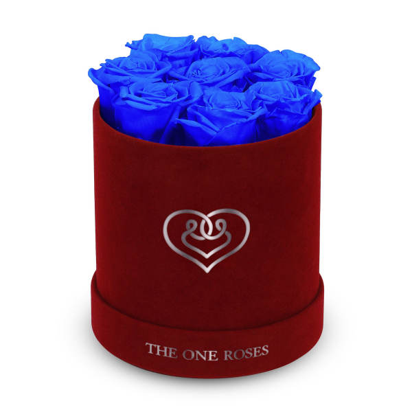Blue roses arranged in a red round box with a heart logo
