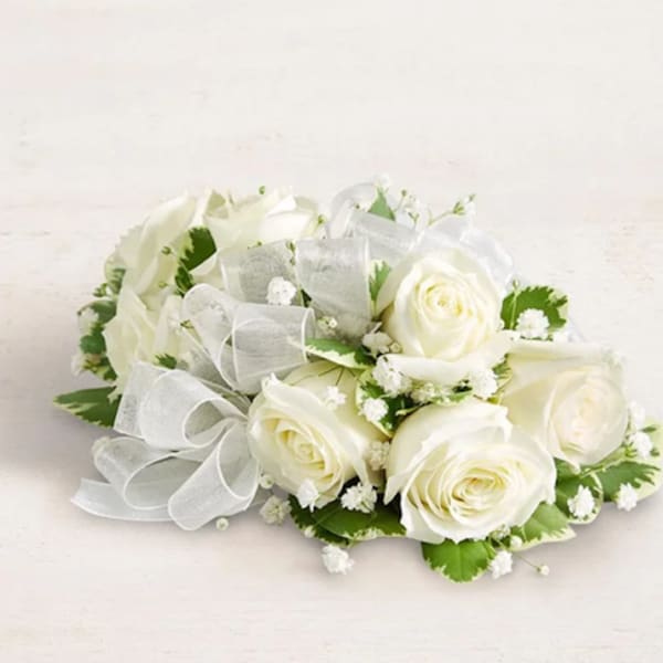White rose bouquet with baby's breath and a sheer ribbon