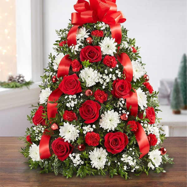 Tree-shaped floral arrangement with red roses, white daisies, and red ribbon bows