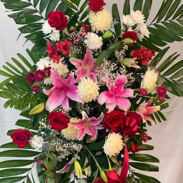 Standing floral spray with red roses and pink lilies