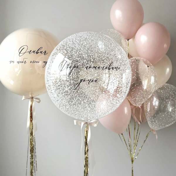 Pastel balloons with clear confetti balloons and gold ribbons