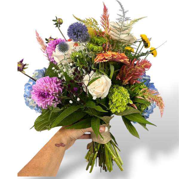 Handheld bouquet with mixed colorful flowers and greenery