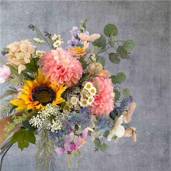 Mixed bouquet with pink dahlias, a sunflower, and pastel flowers