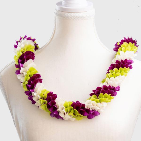 Flower lei in purple, white, and lime green on a dress form