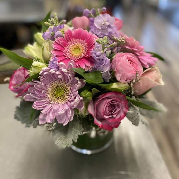 Pink and lavender mixed bouquet in a glass vase