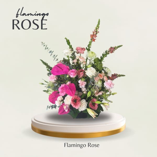 Pink and white floral arrangement with roses and tall spikes