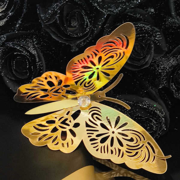 Black rose bouquet with two gold butterfly decorations