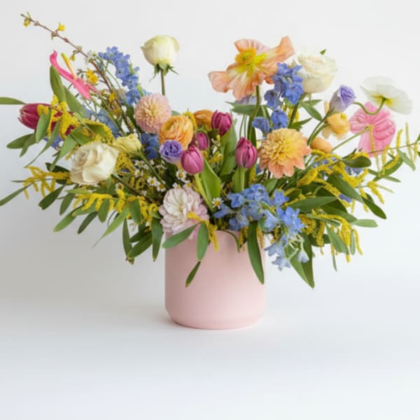 Colorful mixed bouquet in a pink vase