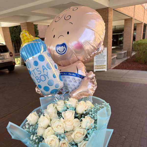 Bouquet of white roses with blue baby-themed balloons