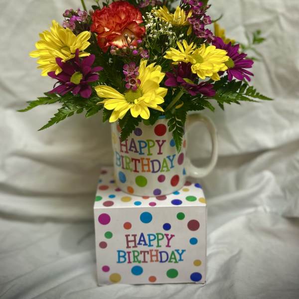 Birthday flower arrangement in a mug with a balloon and gift box
