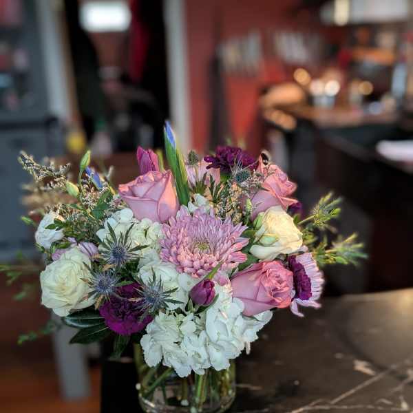 Mixed pink and white bouquet in a clear glass vase