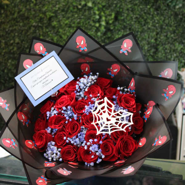 Bouquet of red roses with blue filler and Spider-Man wrapping