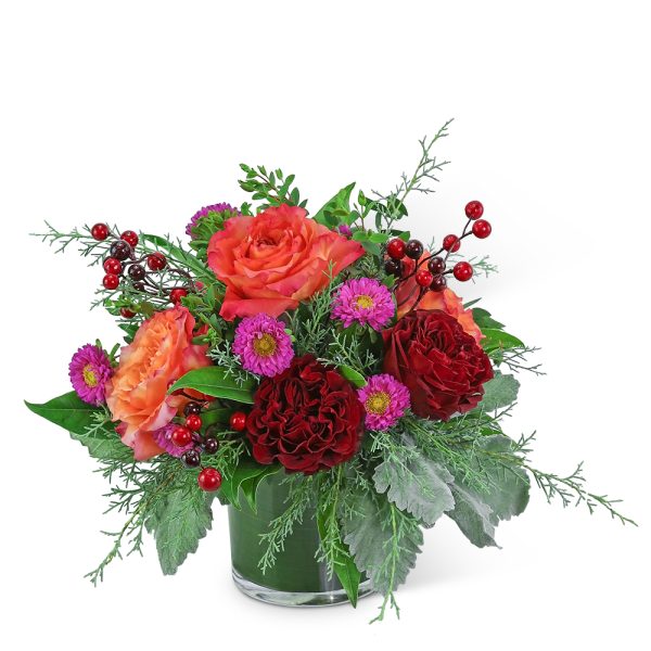 Bouquet of red and orange roses with purple daisies in a glass vase