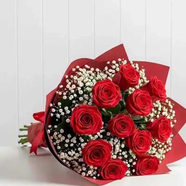 Bouquet of red roses with white baby's breath wrapped in red paper