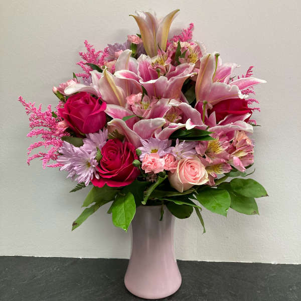 Pink and white mixed bouquet in a pale pink vase