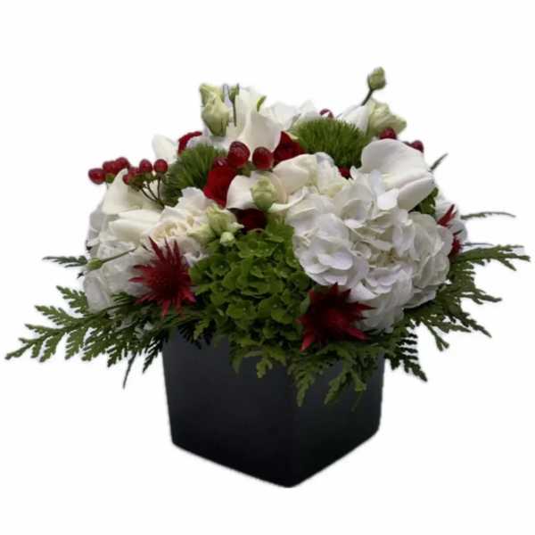 White and red floral arrangement in a black square container