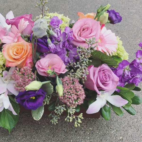 Mixed bouquet of pink, purple, and peach flowers