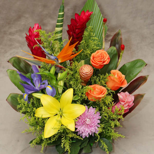 Tropical bouquet with roses, lilies, iris, and bird of paradise