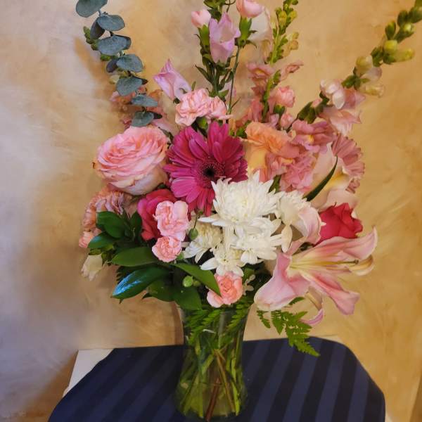 Pink and white mixed bouquet in a clear glass vase