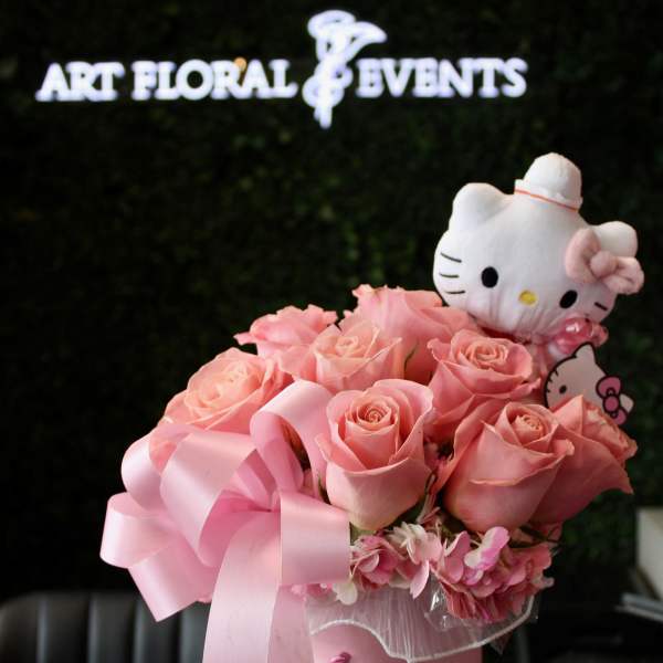 Pink rose bouquet in a pink hatbox with a Hello Kitty plush