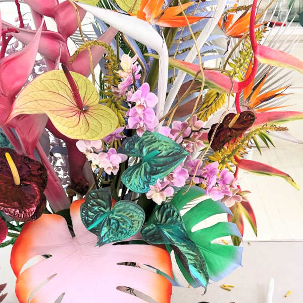 Tropical arrangement with orchids and colorful anthuriums