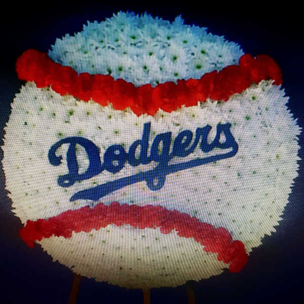 Dodgers-themed floral display shaped like a baseball