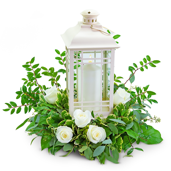 White lantern centerpiece with roses and greenery
